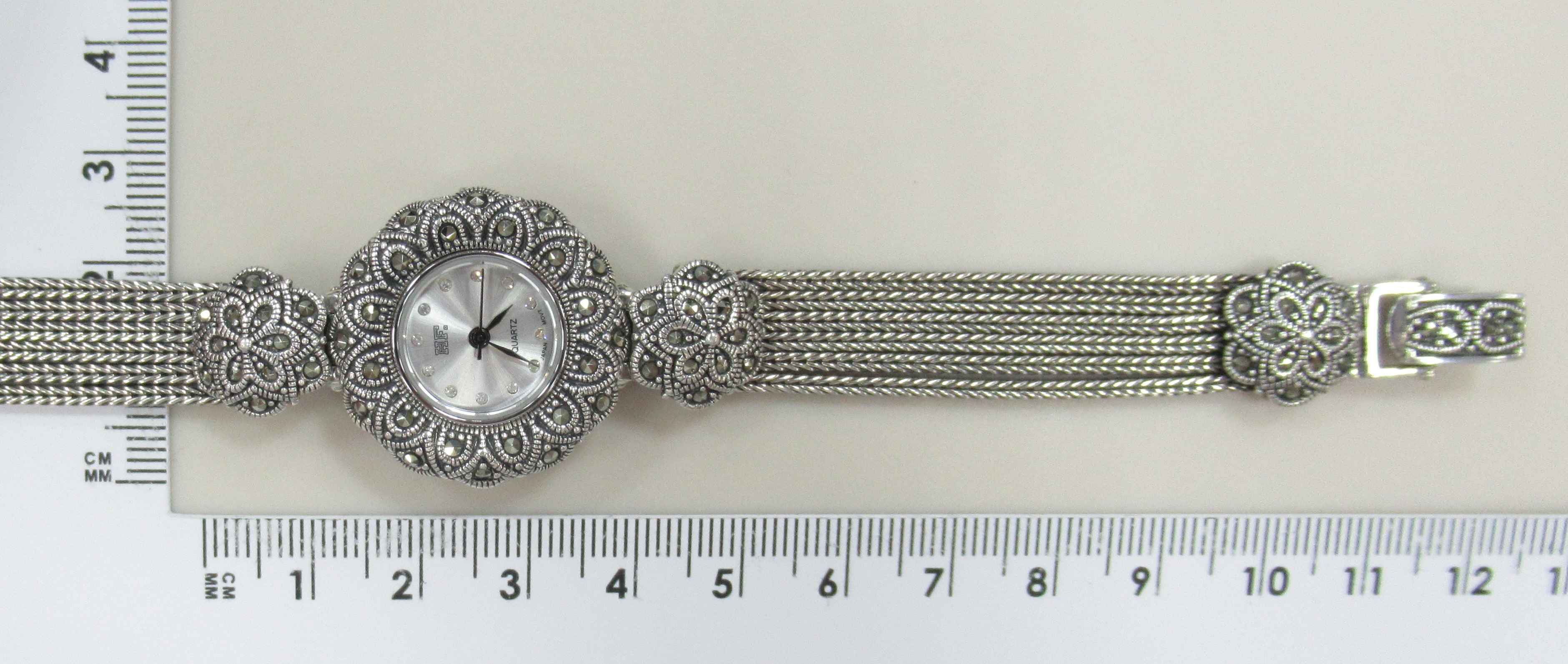 Серебряные часы с марказитами